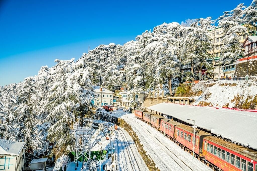 Snow-covered Shimla with a toy train on the railway line